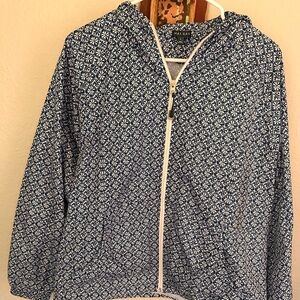 Blue and white water repellent zip front jacket with pockets. Never worn. Size L